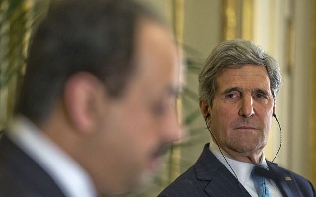 US Secretary of State John Kerry, right, listens to Qatar's Foreign Minister Khalid al-Attiyah, left, during their joint news conference at the US Ambassador's residence in Paris, France, Sunday, Jan. 12, 2014 (photo credit: AP/Pablo Martinez) US Secretary of State John Kerry, right, listens to Qatar's Foreign Minister Khalid al-Attiyah, left, during their joint news conference at the US Ambassador's residence in Paris, France, Sunday, Jan. 12, 2014 (photo credit: AP/Pablo Martinez)