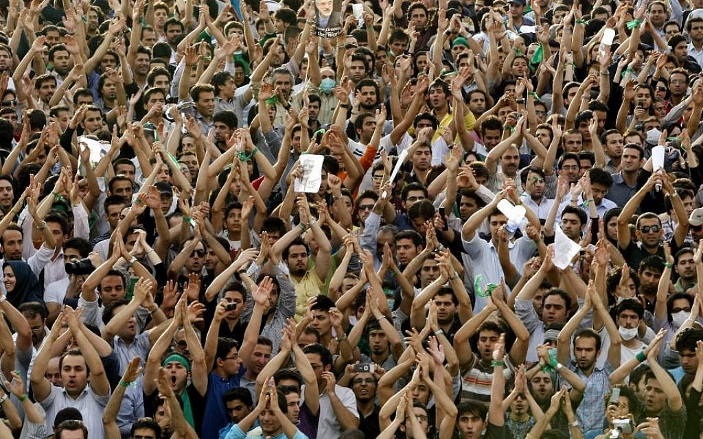 In this Monday, June 15, 2009 file photo, hundreds of thousands of supporters of leading opposition presidential candidate Mir Hossein Mousavi, who claims there was voting fraud in Friday's election, turn out to protest the result of the election at a mass rally in Azadi (Freedom) square in Tehran, Iran. (photo credit: AP Photo/Ben Curtis, File) In this Monday, June 15, 2009 file photo, hundreds of thousands of supporters of leading opposition presidential candidate Mir Hossein Mousavi, who claims there was voting fraud in Friday's election, turn out to protest the result of the election at a mass rally in Azadi (Freedom) square in Tehran, Iran. (photo credit: AP Photo/Ben Curtis, File)
