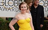 Lena Dunham arrives at the 71st annual Golden Globe Awards at the Beverly Hilton Hotel on Sunday, Jan. 12, 2014, in Beverly Hills, Calif. (Jordan Strauss/Invision/AP)