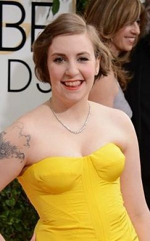 Lena Dunham arrives at the 71st annual Golden Globe Awards at the Beverly Hilton Hotel on Sunday, Jan. 12, 2014, in Beverly Hills, Calif. (Jordan Strauss/Invision/AP)