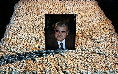 A portrait of slain Lebanese prime minister Rafik Hariri sits on his flower-covered grave in downtown Beirut, Lebanon, January 15, 2014. (AP/Hussein Malla)