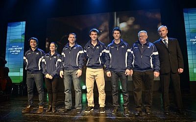 Oleksii Bychenko, Andrea Davidovitch, Evgeny Krasnapolsky, Virgile Vandeput and Vladislav Bykanov, Israel's Olympic athletes,  alongside Boris Chait, President of the Israeli Ice Skating Federation, and Vladimir Shklar, far right, the head of the delegation (Photo credit: Courtesy of Olympic Committee of Israel)