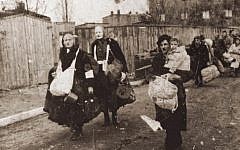 Illustrative photo of Lodz Ghetto residents, who head toward the trains that will take them to Chelmno extermination camp, in Poland (photo credit: unknown)