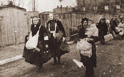Lodz Ghetto residents head toward the trains that will take them to Chelmno extermination camp, in Poland (photo credit: unknown)