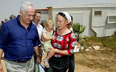 Benjamin Netanyahu, then leader of the opposition, visits a West Bank settlement outpost in 2007 (Photo credit: Olivier Fitoussi /Flash90)