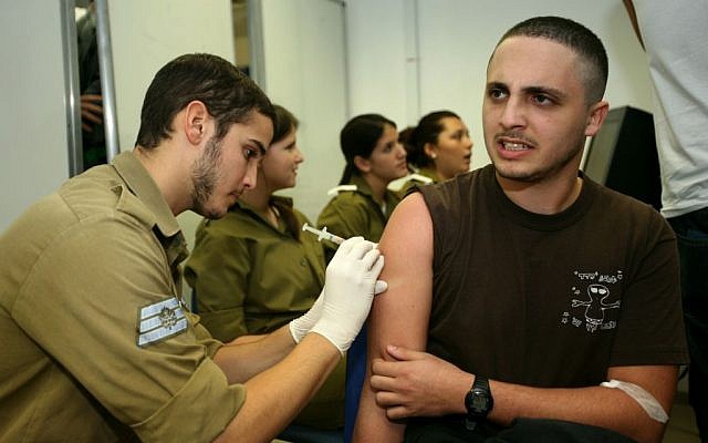 Illustrative photo: An Israeli recruit receives an injection (Photo credit: Moshe Shai/FLASH90) Illustrative photo: An Israeli recruit receives an injection (Photo credit: Moshe Shai/FLASH90)
