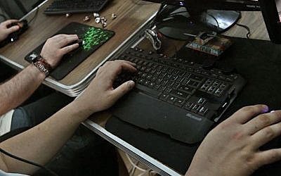 A new law by MK Yifat Kariv labels the sharing of sexually explicit media on the Internet as a sexual offense, punishable by up to five years in prison. (Illustrative photo: Dror Garti/Flash90)