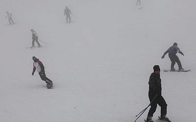 Israelis seen skiing on the snowcovered slopes of Mt Hermon, in Northern Israel (Photo credit: Yaakov Naumi/Flash90)