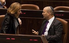 Justice Minister Tzipi Livni, left, speaks with Economy Minister Naftali Bennett at a Knesset session marking 18 years since the assassination of prime minister Yitzhak Rabin, October 16, 2013 (photo credit: Flash90)