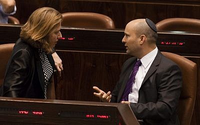 Justice Minister Tzipi Livni, left, speaks with Economy Minister Naftali Bennett at a Knesset session marking 18 years since the assassination of prime minister Yitzhak Rabin, October 16, 2013 (photo credit: Flash90) Justice Minister Tzipi Livni, left, speaks with Economy Minister Naftali Bennett at a Knesset session marking 18 years since the assassination of prime minister Yitzhak Rabin, October 16, 2013 (photo credit: Flash90)