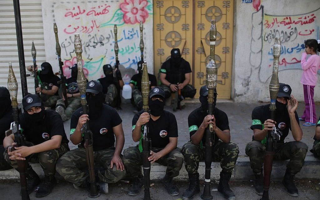 Hamas fighters sitting during an anti-Israel parade in Gaza in November, 2013. (photo credit:  Wissam Nassar/Flash90)