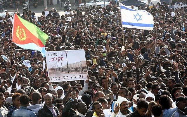 Thousands of asylum seekers from Eritrea and Sudan protest the Israeli government's neglect in reviewing asylum requests and the state's detention policies, at a demonstration held at Rabin Square, central Tel Aviv, January 05, 2013. (photo credit: Roni Schutzer/Flash90) Thousands of asylum seekers from Eritrea and Sudan protest the Israeli government's neglect in reviewing asylum requests and the state's detention policies, at a demonstration held at Rabin Square, central Tel Aviv, January 05, 2013. (photo credit: Roni Schutzer/Flash90)