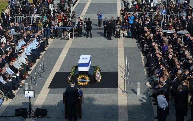 President Shimon Peres eulogizes former prime minister Ariel Sharon in Jerusalem, Monday, January 13, 2014 photo credit: Amos Ben Gershom/GPO/Flash90) President Shimon Peres eulogizes former prime minister Ariel Sharon in Jerusalem, Monday, January 13, 2014 photo credit: Amos Ben Gershom/GPO/Flash90)