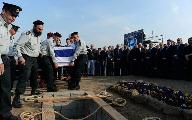 Generals placing Ariel Sharon's coffin in a grave at Sycamore Farm on Monday, January 13, 2014. (photo credit: Kobi Gideon/GPO/Flash 90) Generals placing Ariel Sharon's coffin in a grave at Sycamore Farm on Monday, January 13, 2014. (photo credit: Kobi Gideon/GPO/Flash 90)