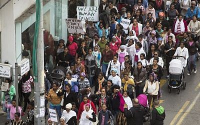 Hundreds of female African asylum seekers and their children participate in a protest march towards the US Embassy in Tel Aviv on January 15, 2014, calling on the Israeli government to grant them asylum and work rights. (photo credit: Matanya Tausig/Flash90)