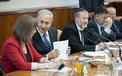 Prime Minister Binyamin Netanyahu speaks with Culture and Sports Minister Limor Livnat (L) during the weekly cabinet meeting at the Prime Minister's Office in Jerusalem on January 19, 2014. (photo credit: Emil Salman/POOL/Flash90)