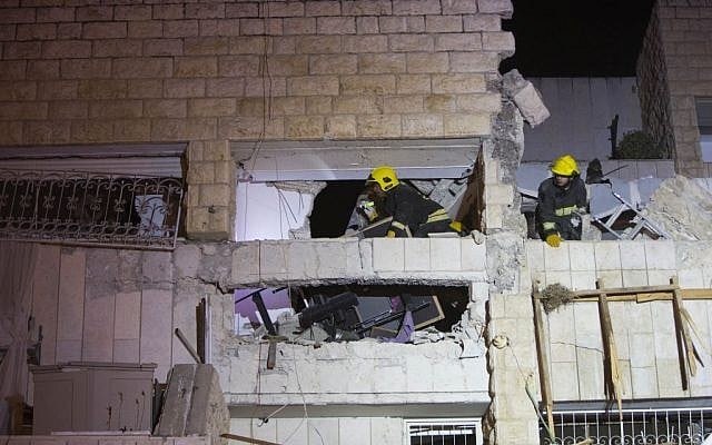 Rescue and medical personnel at the scene of a gas explosion that killed three people in Jerusalem's Gilo neighborhood, early Monday morning, January 20, 2014 (photo credit: Yonatan Sindel/Flash90) Rescue and medical personnel at the scene of a gas explosion that killed three people in Jerusalem's Gilo neighborhood, early Monday morning, January 20, 2014 (photo credit: Yonatan Sindel/Flash90)