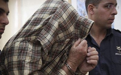 The exterminator who left the poison that led to the deaths of two children in Givat Mordechai is seen during a court hearing in Jerusalem on January 23, 2014. Photo by Hadas Parush/Flash90