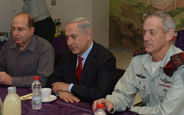 Prime Minister Benjamin Netanyahu (center), Defence Minister Moshe Ya'alon and IDF Chief of Staff Benny Gantz in a meeting on January 27, 2014. (photo credit: Amos Ben Gershom/GPO/Flash90) Prime Minister Benjamin Netanyahu (center), Defence Minister Moshe Ya'alon and IDF Chief of Staff Benny Gantz in a meeting on January 27, 2014. (photo credit: Amos Ben Gershom/GPO/Flash90)