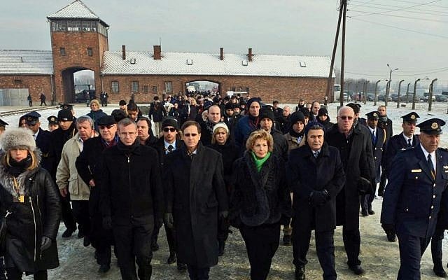 Knesset members and other Israeli dignitaries walk through the entrance to the Auschwitz concentration camp in Poland on International Holocaust Remembrance Day, January 27, 2014. (Photo credit: Haim Zach/GPO/Flash90) Knesset members and other Israeli dignitaries walk through the entrance to the Auschwitz concentration camp in Poland on International Holocaust Remembrance Day, January 27, 2014. (Photo credit: Haim Zach/GPO/Flash90)