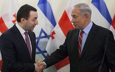 Prime Minister Benjamin Netanyahu shake hands with Prime Minister of Georgia, Irakli Garibashvili at a joint press conference in Jerusalem on January 28, 2014. (Photo credit: Yonatan Sindel/Flash90)