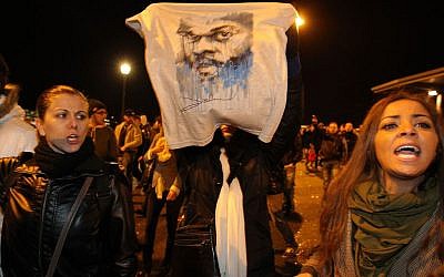 A supporter of French comic Dieudonne Mbala Mbala displays a t-shirt with his image, in front of Zenith Area in Nantes, western France, Thursday, Jan. 9, 2014. (photo credit: AP/David Vincent)