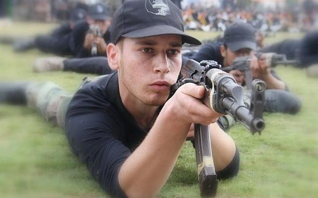 A child practices shooting at the 'pioneers of liberation' camp in Gaza (photo credit: Hamas interior ministry website)