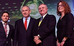 Prime Minister Benjamin Netanyahu with President of Ben Gurion University Prof. Rivka Karmi (R), Vice President of IBM, Steve Mills (2-R), and Mayor of Beersheva, Rubik Danilovich (L), at Cybertech 2014. (Photo credit: Kobi Gideon/GPO/Flash 90)