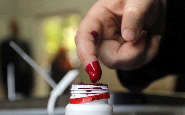 An Egyptian woman dips her finger in ink to show she has voted at a polling station in Cairo, Egypt, Tuesday (photo credit: AP/Amr Nabil) An Egyptian woman dips her finger in ink to show she has voted at a polling station in Cairo, Egypt, Tuesday (photo credit: AP/Amr Nabil)
