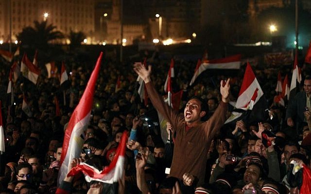 In this Feb. 11, 2011 file photo, Egyptians celebrate the news of the resignation of President Hosni Mubarak, who handed control of the country to the military, at night in Tahrir Square in downtown Cairo, Egypt.(AP Photo/Ben Curtis) In this Feb. 11, 2011 file photo, Egyptians celebrate the news of the resignation of President Hosni Mubarak, who handed control of the country to the military, at night in Tahrir Square in downtown Cairo, Egypt.(AP Photo/Ben Curtis)