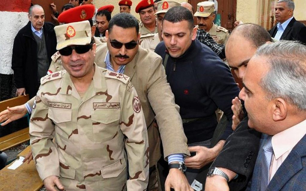 Abdel-Fattah el-Sissi, left, visits a polling site in the Heliopolis neighborhood of Cairo, Egypt, on the first day of voting in the constitutional referendum, on Jan 14, 2014 (photo credit: AP/Egyptian Defense Ministry via Facebook/File) Abdel-Fattah el-Sissi, left, visits a polling site in the Heliopolis neighborhood of Cairo, Egypt, on the first day of voting in the constitutional referendum, on Jan 14, 2014 (photo credit: AP/Egyptian Defense Ministry via Facebook/File)