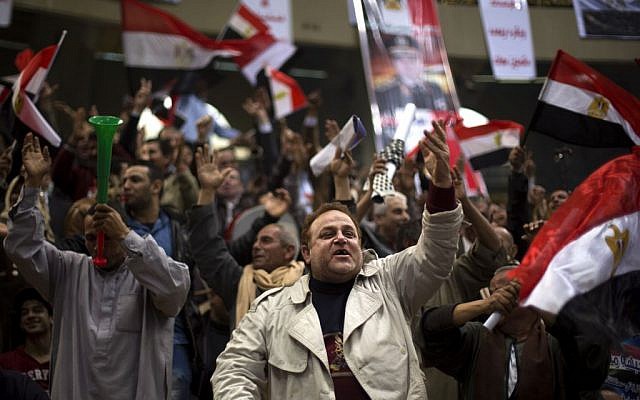 Egyptians chant slogans as they attend a rally in support of Egypt's Defense Minister, Gen. Abdel-Fattah el-Sissi, in Cairo, Egypt, Tuesday, Jan. 21, 2014. (Photo credit: AP Photo/Khalil Hamra) Egyptians chant slogans as they attend a rally in support of Egypt's Defense Minister, Gen. Abdel-Fattah el-Sissi, in Cairo, Egypt, Tuesday, Jan. 21, 2014. (Photo credit: AP Photo/Khalil Hamra)