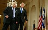 George W. Bush, right, and Ariel Sharon, left, walk together at the end of a joint press conference in the Cross Hall of the White House in Washington in April, 2004. (AP/Pablo Martinez Monsivais, File)