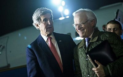 US Secretary of State John Kerry, left, walks with US Special Envoy for Israeli-Palestinian Negotiations Martin Indyk, right, at Ben Gurion International Airport, Tel Aviv, Israel, on January 5, 2014. (photo credit: AP/Brendan Smialowski/Pool)