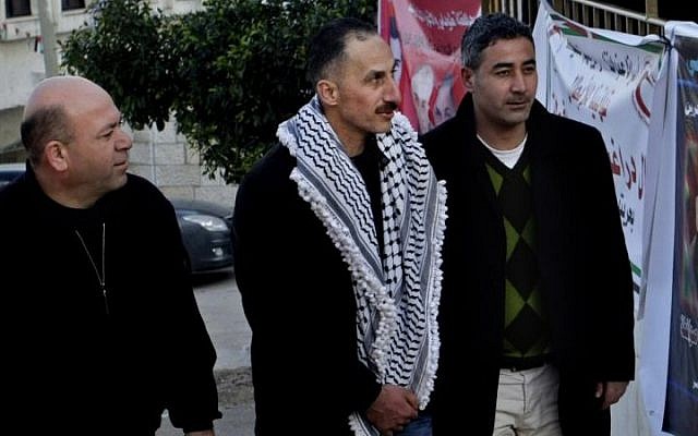 Recently released Palestinian prisoner Jamal Abu Muhsin, center, earned two degrees during his decades of imprisonment in Israel. (photo credit: AP Photo/Nasser Ishtayeh) Recently released Palestinian prisoner Jamal Abu Muhsin, center, earned two degrees during his decades of imprisonment in Israel. (photo credit: AP Photo/Nasser Ishtayeh)
