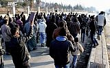 In this Monday, Jan. 6, 2014 citizen journalism image, Syrians hold copies of the Quran during a demonstration to stop fighting between the Islamic State of Iraq and Syria (ISIS) and rebels, in Aleppo, Syria (photo credit: AP/Aleppo Media Center)