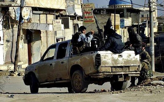 Illustrative photo of Islamic State fighters in Syria, January 14, 2014 (photo credit: AP/militant website) Illustrative photo of Islamic State fighters in Syria, January 14, 2014 (photo credit: AP/militant website)