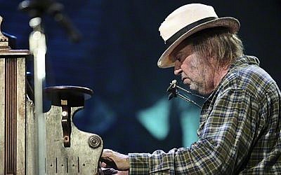 Neil Young performing at Farm Aid, one of his longstanding gigs, in 2010 (Courtesy Wikipedia)