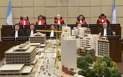 Back row, from left: Judge Walid Akoum, Judge Janet Nosworthy, Presiding Judge David Re, Judge Micheline Braidy and Judge Nicola Lettier await the start of a trial at the courtroom of the Special Tribunal for Lebanon in Leidschendam, Netherlands, on Thursday, January 16, 2014. (photo credit: AP/Toussaint Kluiters)