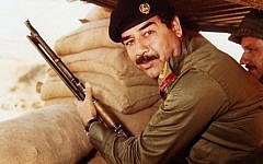 Saddam Hussein during Iran-Iraqi war in the 1980s. (Public domain, Wikimedia Commons)
