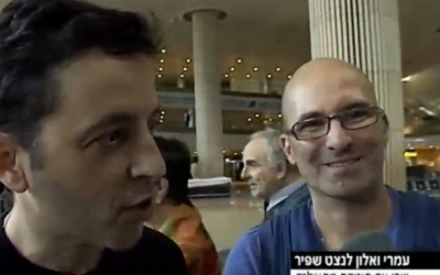 Alon, left, and Omri Lanchet-Shapir arrived at Ben Gurion Airport Friday with their newborn son, Shai (photo credit: screenshot Channel 2)