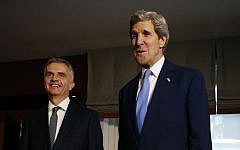 US Secretary of State John Kerry, right, poses with Swiss President Didier Burkhalter for photographers in Davos, Switzerland, Friday, Jan. 24, 2014. (photo credit: AP/Gary Cameron)