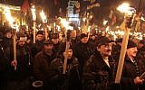 Ukrainian nationalists carry torches during a rally in downtown Kiev, Ukraine, early January. (photo credit: AP/Sergei Chuzavkov)