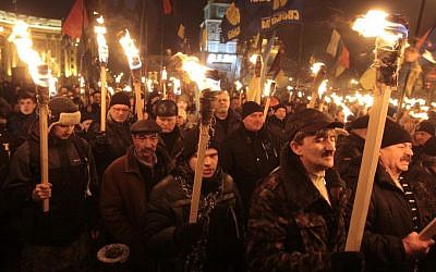 Ukrainian nationalists carry torches during a rally in downtown Kiev, Ukraine, early January. (photo credit: AP/Sergei Chuzavkov)