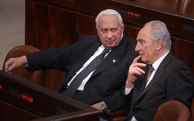 Ariel Sharon, left, with Shimon Peres in the Knesset in 2005. (photo credit: Sharon Perry/Flash90)