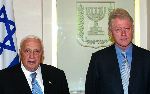 Former United States president Bill Clinton with former Israeli prime minister Ariel Sharon during a meeting at the prime minister's office in Jerusalem in 2005. (Photo credit: Flash90)