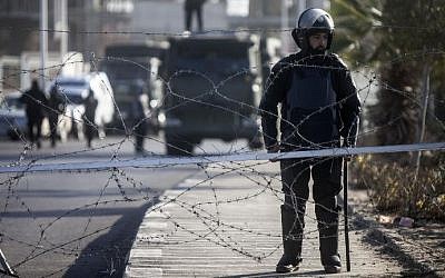 Illustrative photo of Egyptian riot police stand guard in Cairo, January 28, 2014. (AFP/Mahmoud Khaled)