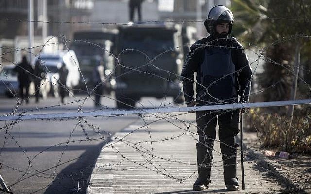 Illustrative photo of Egyptian riot police stand guard in Cairo, January 28, 2014. (AFP/Mahmoud Khaled) Illustrative photo of Egyptian riot police stand guard in Cairo, January 28, 2014. (AFP/Mahmoud Khaled)