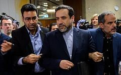 Iran's Deputy Foreign Minister Abbas Araqchi (C) is surrounded by journalists following a press conference on November 10, 2013, in Geneva. (AFP/File Fabrice Coffrini)