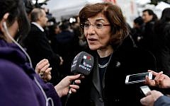Syrian senior presidential advisor Buthaina Shaaban speaks to a Syrian TV reporter at the United Nations Offices in Geneva, on January 26, 2014. (Fabrice Coffrini/AFP)